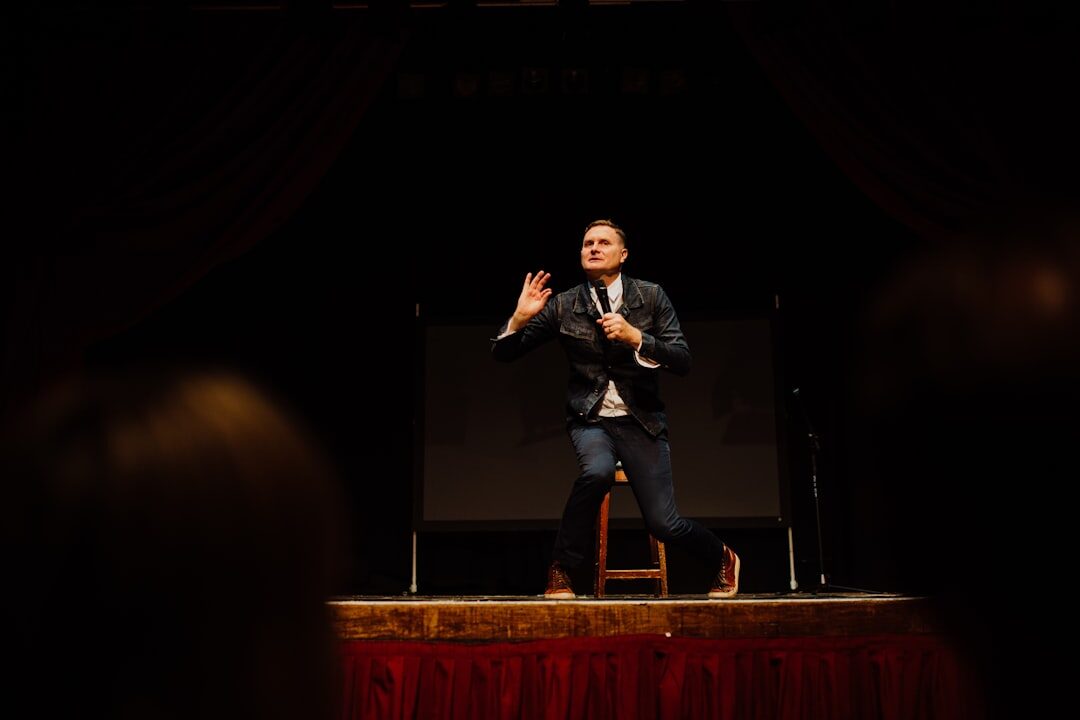 humorist with microphone on stage