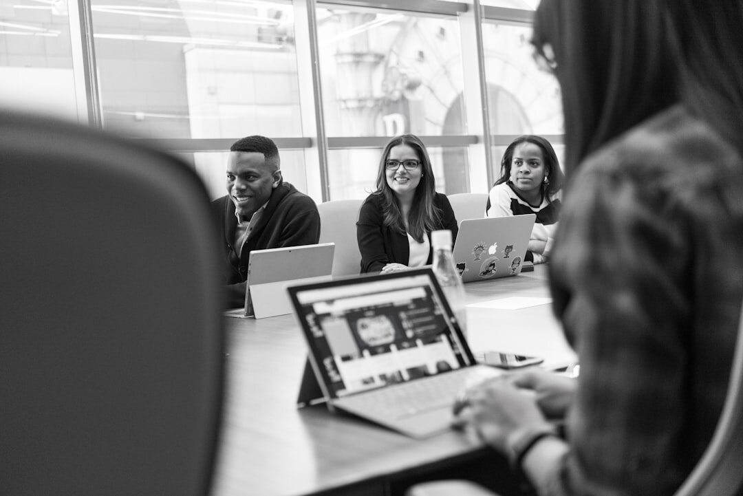 Team of journalists working together in a modern newsroom