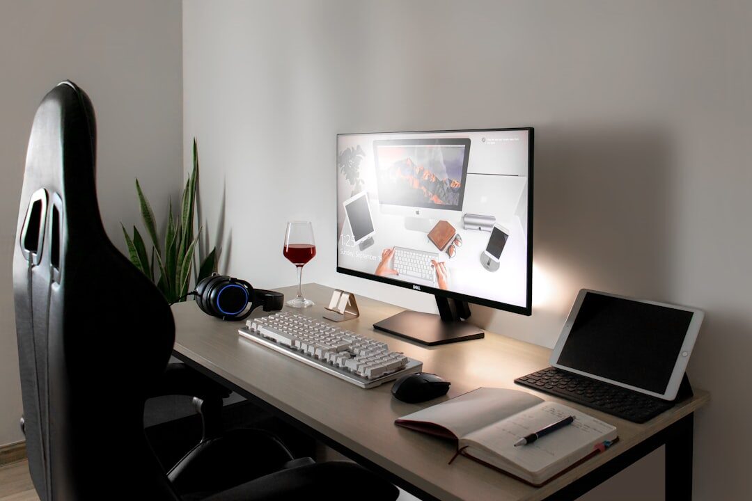 Bright modern editorial office with desks and computer screens